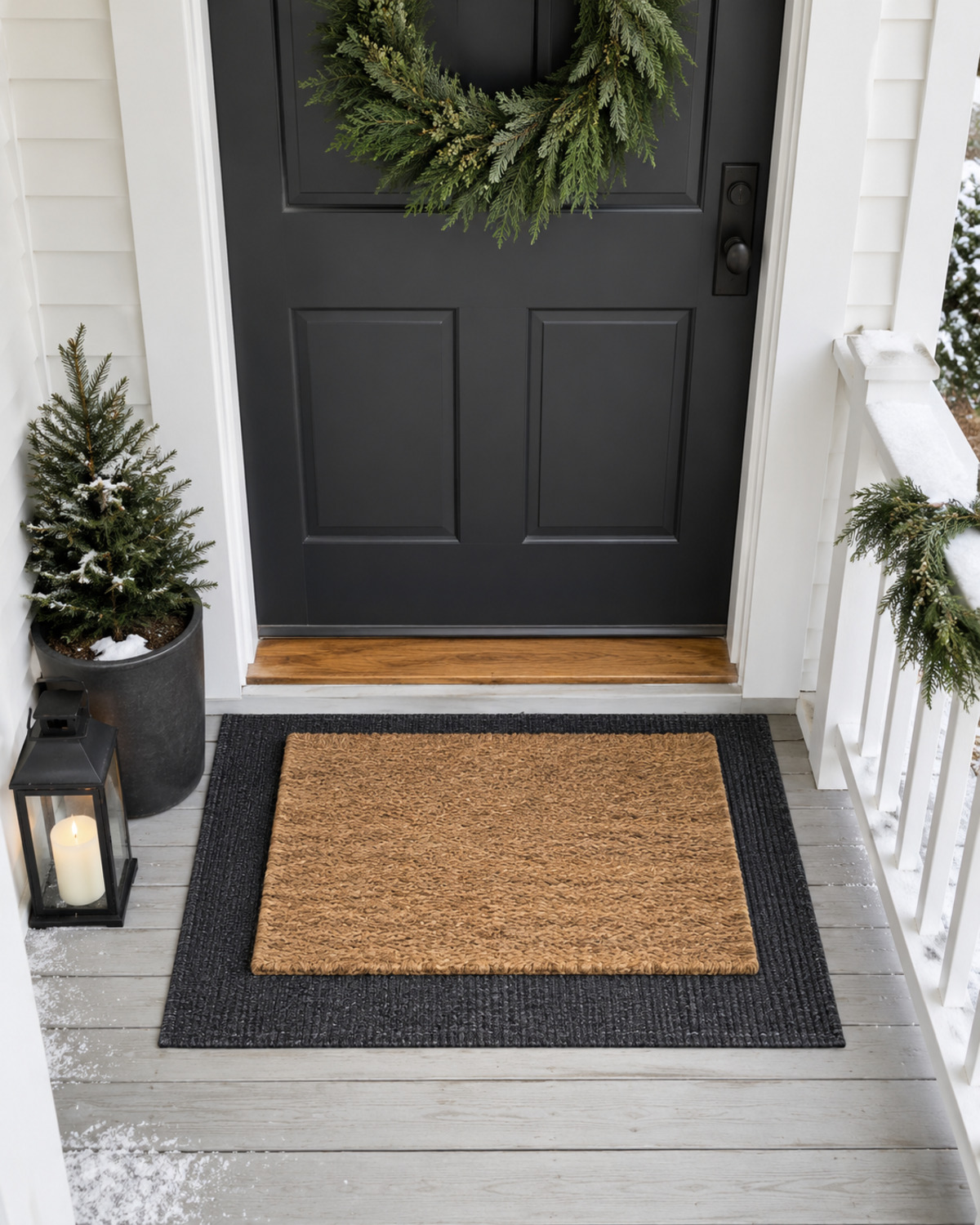 Neutral outdoor runner layered beneath a plain coir doormat on a small Christmas porch